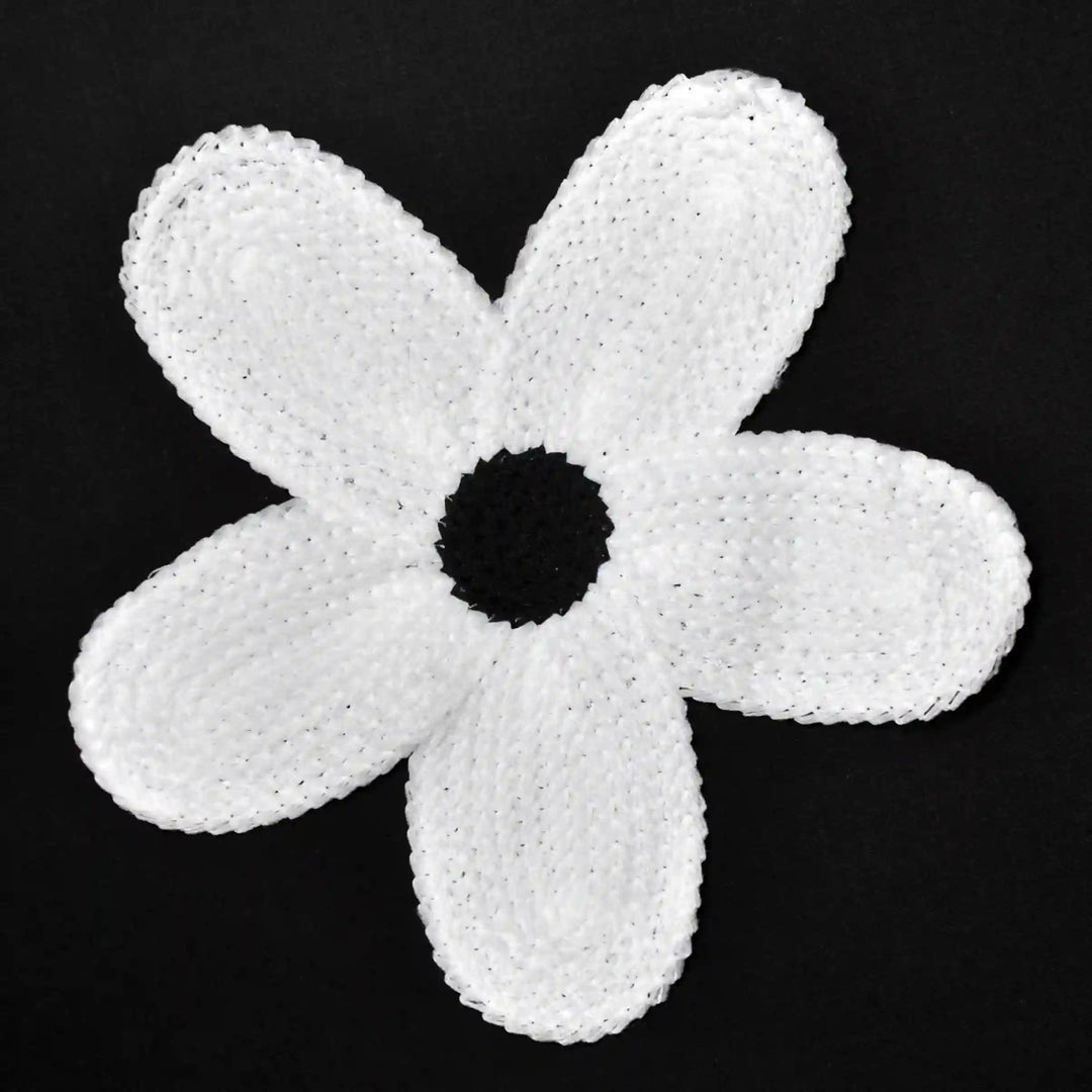 ANI Accessories white daisy guipure lace patch in spun poly with five petals, on black background 