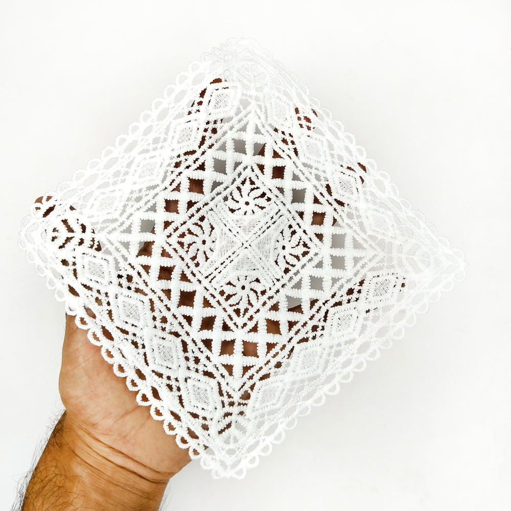 ANI Accessories white diamond pattern patch held in a hand to show its size 