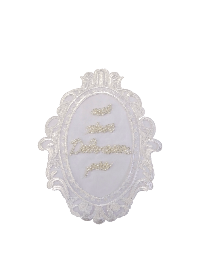 ANI Accessories white embroidered oval frame patch on a white background 