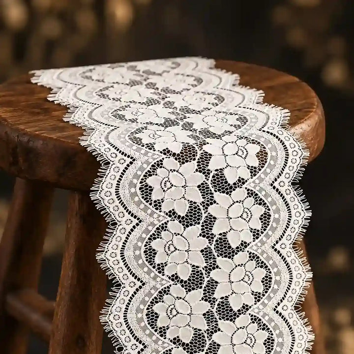 ANI Accessories white floral lace for dress laid over a wooden stool