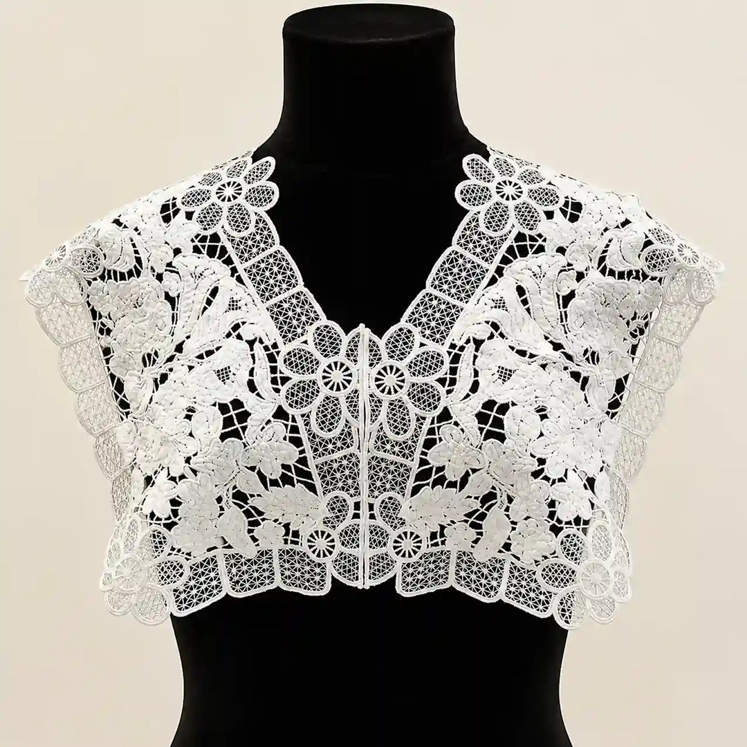ANI Accessories white floral lace V-neck collar yoke on a black dress form, front view on beige background