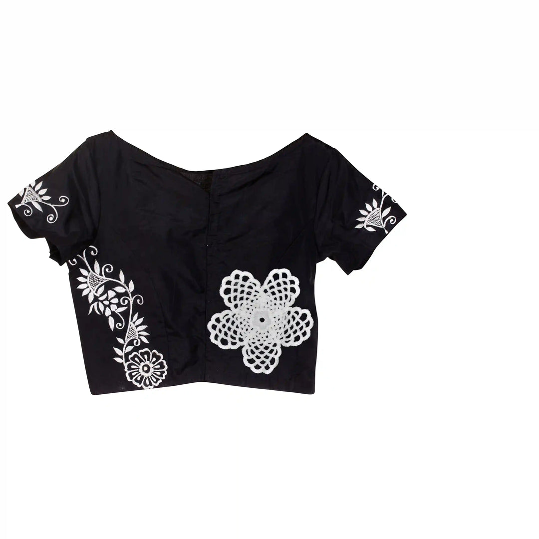 ANI Accessories white flower patches stitched on the sleeve and hem of a black blouse with white color Background 