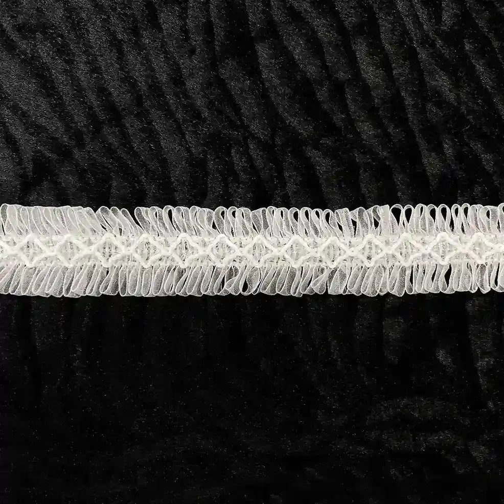 ANI Accessories white fringe lace for dupatta laid flat on black background 