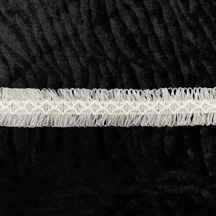 ANI Accessories white fringe lace for dupatta laid flat on black background 