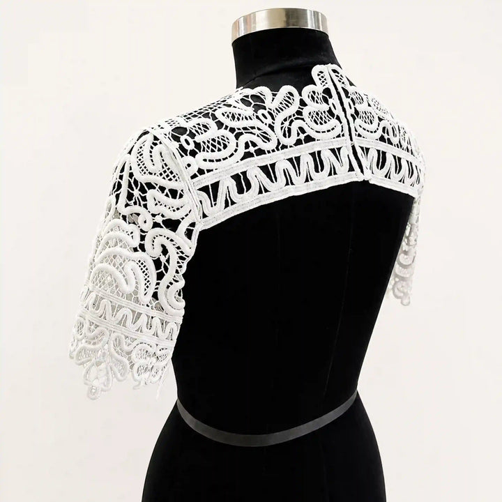 ANI Accessories white guipure lace yoke with cap sleeves on a black dress form, side-back view of shoulders with white color background 