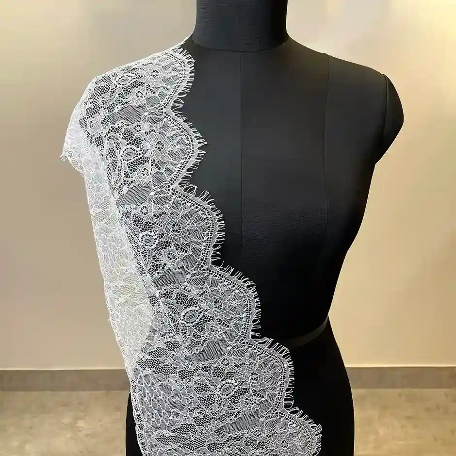 ANI Accessories white lace dress extender draped on a mannequin