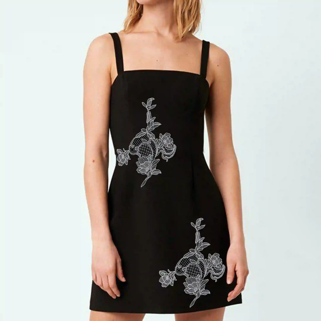 ANI Accessories white flower patch for clothing stitched on the front of a black dress 