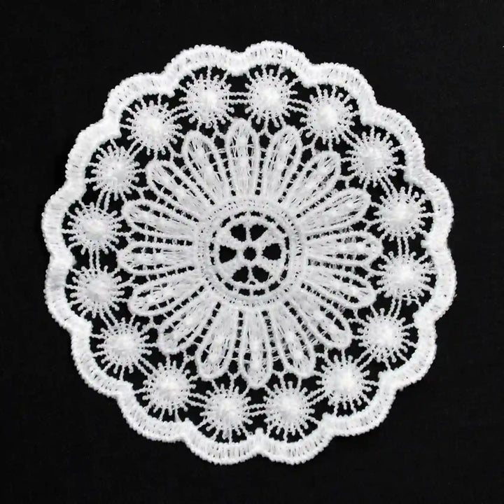 ANI Accessories white round guipure lace patch in spun poly with daisy centre, on black Background 