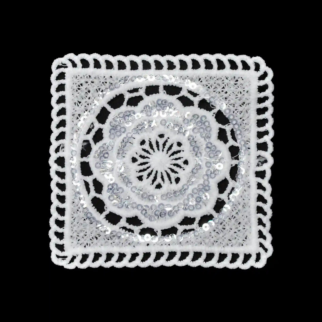 ANI Accessories white sequin square patch in spun poly with round flower centre, on black Background 