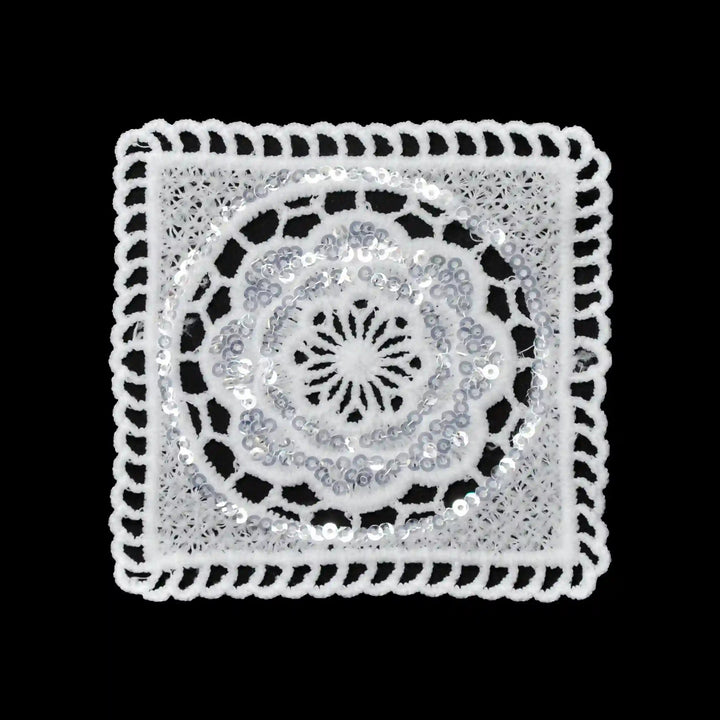 ANI Accessories white sequin square patch in spun poly with round flower centre, on black Background 