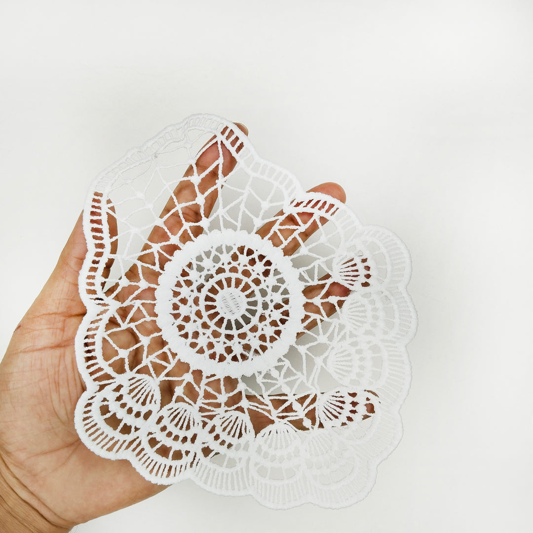 ANI Accessories white spun poly patch held in hand to show its size and open web pattern 