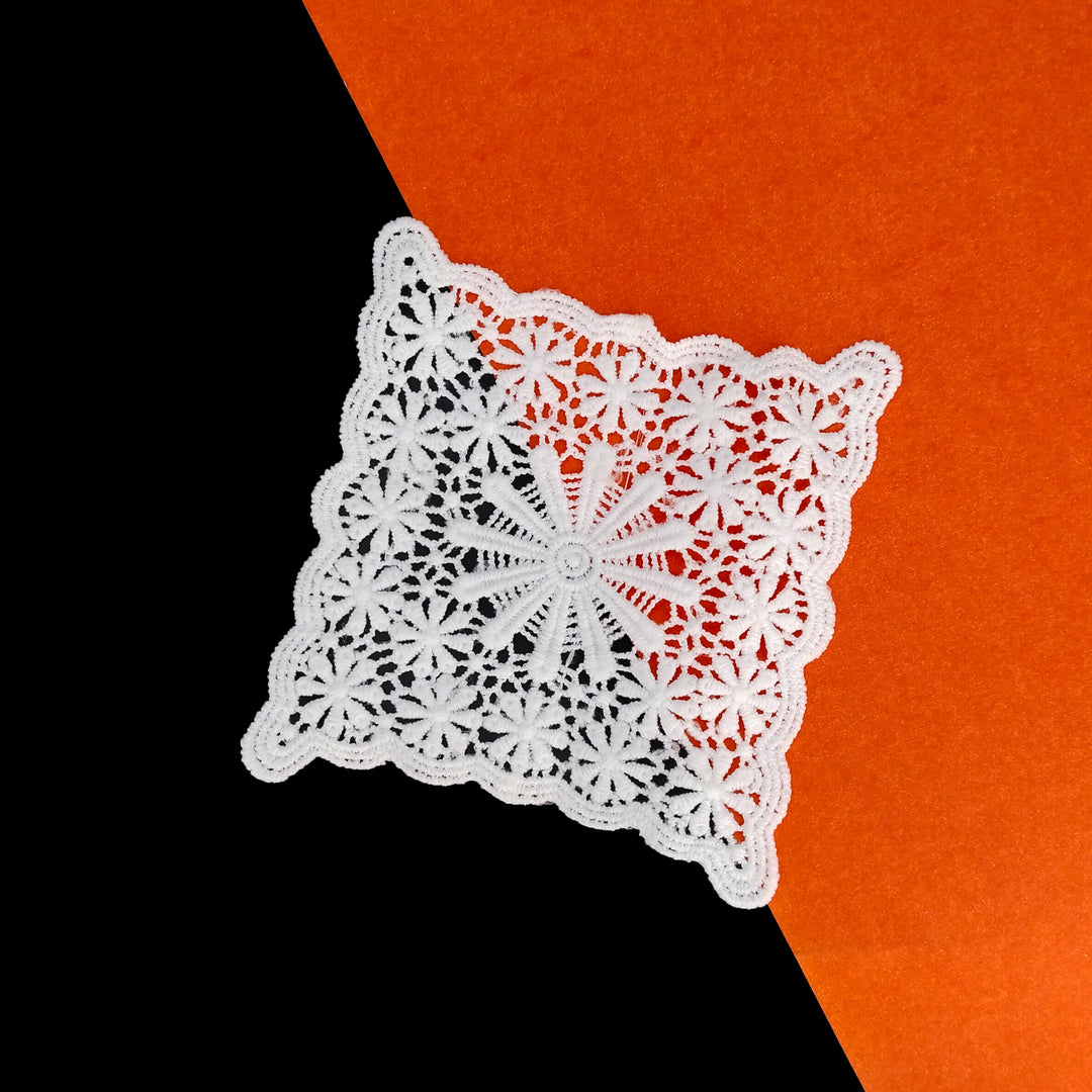 ANI Accessories white square floral patch on a black and orange background 