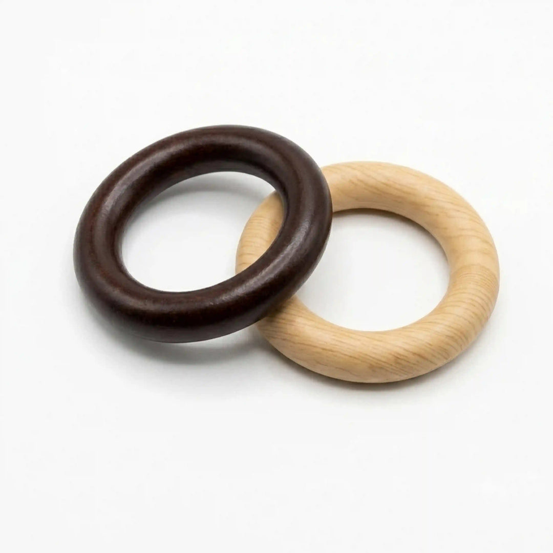 ANI Accessories dark walnut brown and natural wooden O-ring buckles overlapping, angled view of smooth rounded profile